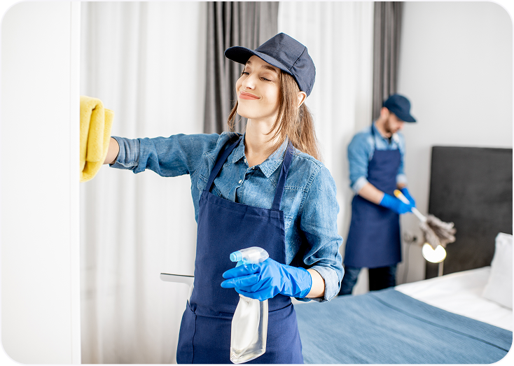 Housekeeping team cleaning and organizing room