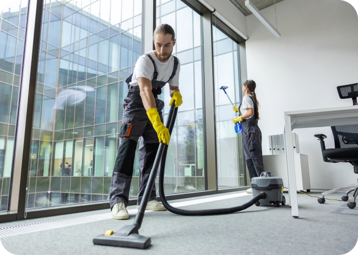 Cleaning team vacuuming office and washing windows